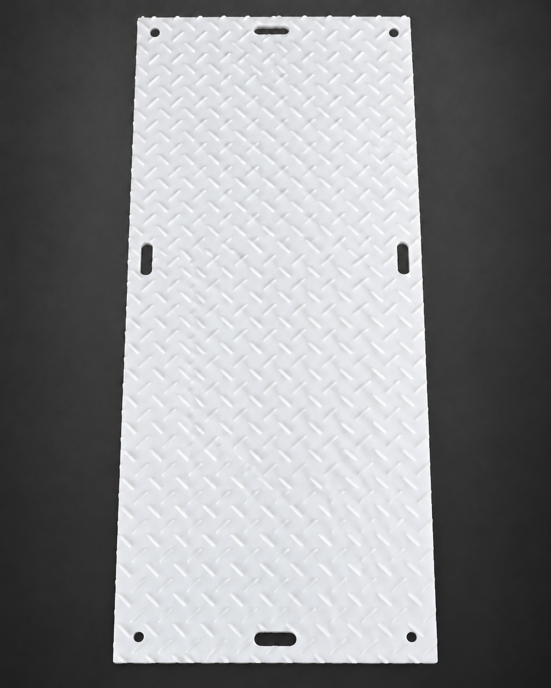 Deep-tread side of a white 3 by 8 ground protection mat with four circular corner holes