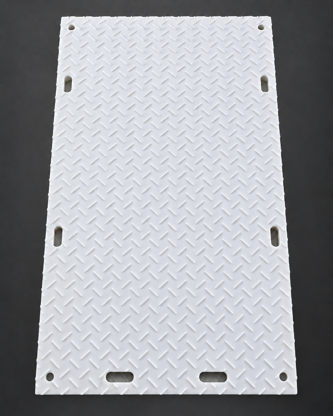 Deep-tread side of a white 4 by 8 ground protection mat with four circular corner holes